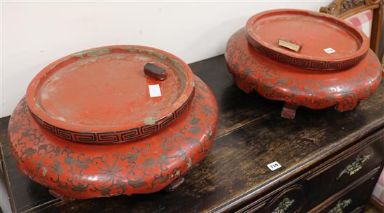 A pair of Chinese red lacquer stands, W.55cm